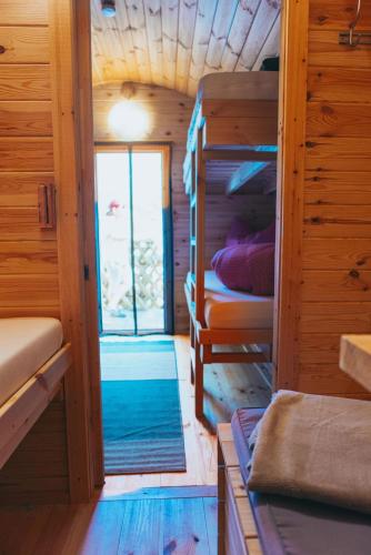 a small room with bunk beds in a cabin at Happis Fassle in Tarrenz