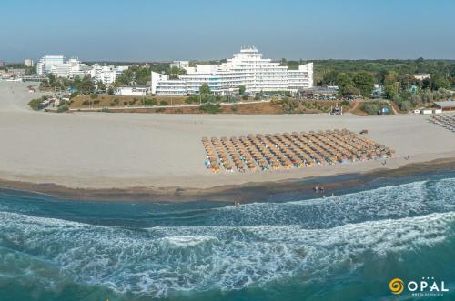 an aerial view of a beach with a large hotel at Hotel Opal in Jupiter