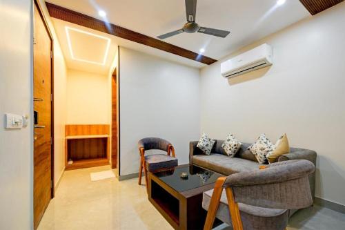 a living room with a couch and a table at Premium Lee Premier in New Delhi