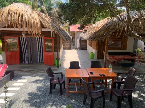 a table and chairs in front of a house at The Tasty Tuna Cabana in Arugam Bay