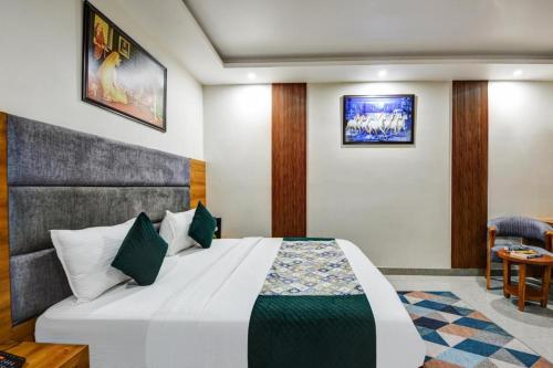 a bedroom with a large white bed in a room at Airport Le Premier, New Delhi in New Delhi