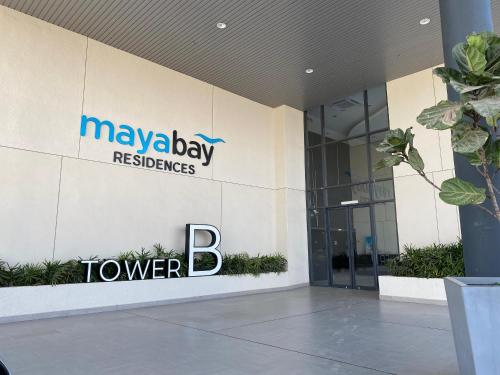 a building with the logo of maybay reserves tower b at 2H mayabay homestay splashmania gamuda cove Klia in Banting