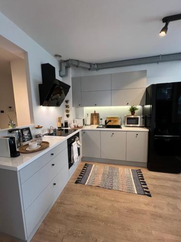 Dapur atau dapur kecil di Wyjątkowy apartament blisko ZOO