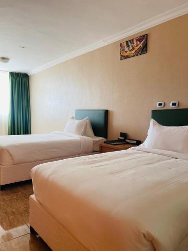 Postel nebo postele na pokoji v ubytování Kenenisaresortandsportcenter