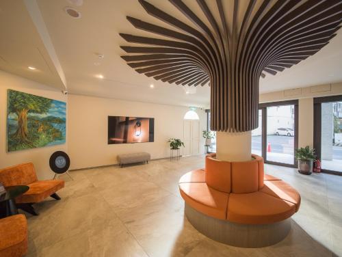 TV a/nebo společenská místnost v ubytování LIVIN Hotel