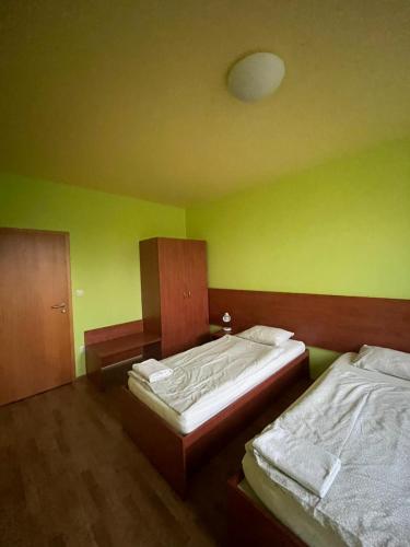 Postel nebo postele na pokoji v ubytování Motorest u Štěpána
