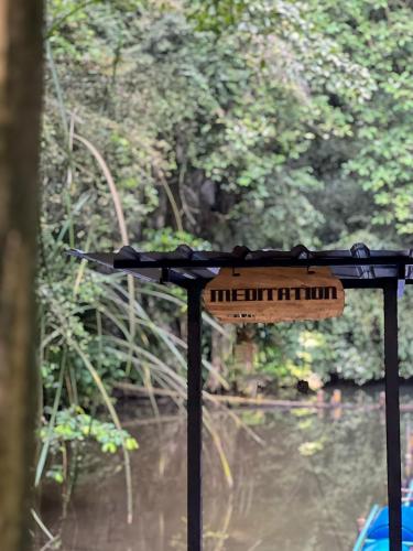 a table with a keyboard on it next to a body of water at Xscape Tambun in Ipoh