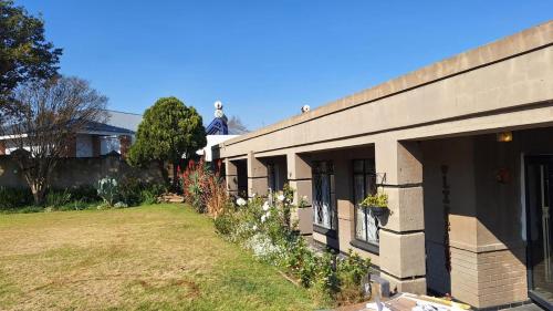 a building with a statue on the top of it at 21 on Main in Benoni