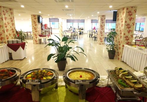 a buffet of food on a table in a cafeteria at City Inn Palace Hotel in Ramallah