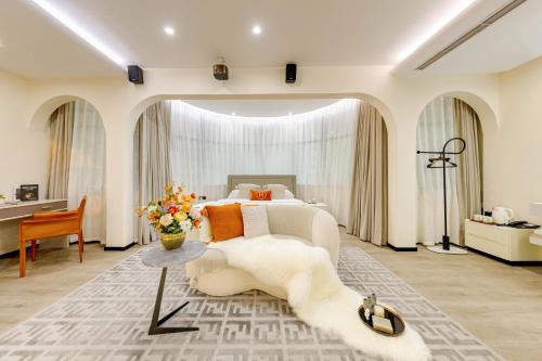 Katil atau katil-katil dalam bilik di Huanyi Hotel