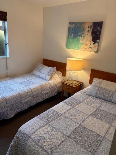 Postel nebo postele na pokoji v ubytování Sumner Bay Motel