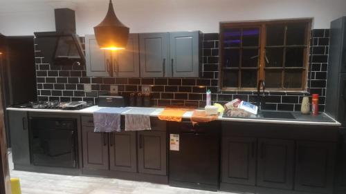 a kitchen with a sink and a counter top at Jo's Eden in Edenvale