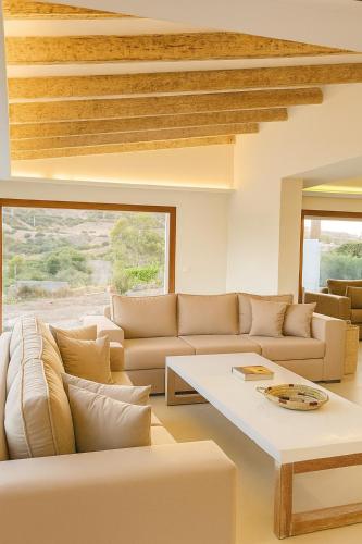 a living room with a couch and a table at Villa Jasmin 12 in M'diq