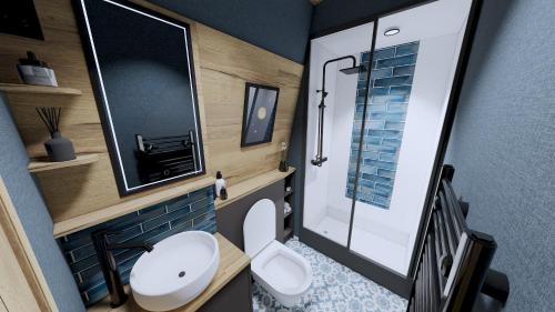 a small bathroom with a toilet and a mirror at Billing Aquadrome Holiday Park in Great Billing