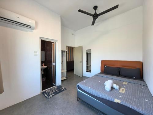 Ένα ή περισσότερα κρεβάτια σε δωμάτιο στο Langkawi Simfoni Luxury Suite 09