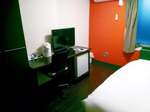 a room with a desk with a computer on it at Ace Inn Asakusa in Tokyo