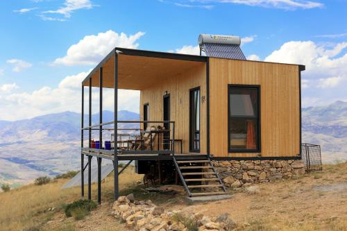a tiny house on top of a hill at Sareni in Areni