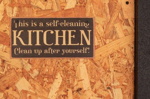 a sign on a wooden door that reads this is a self cleaning kitchenclean up at Sareni in Areni