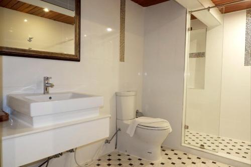 a bathroom with a sink and a toilet and a shower at Delio Boutique Hotel in Udon Thani