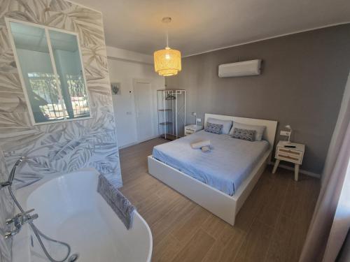 Ένα ή περισσότερα κρεβάτια σε δωμάτιο στο Villa Brisamar - On the beach