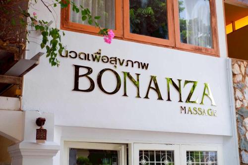 a sign on the side of a building at Delio Boutique Hotel in Udon Thani