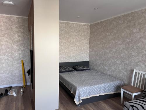 En eller flere senge i et værelse på Квартира