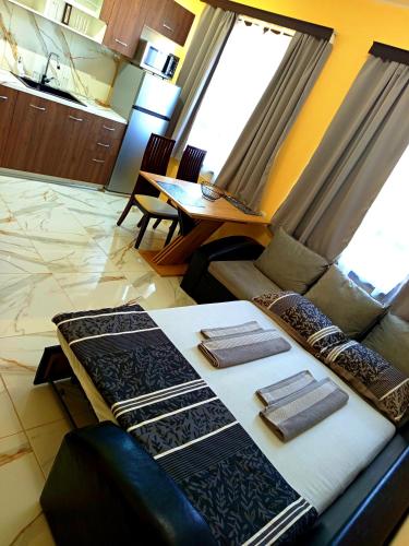 a living room with a couch and a table at Elixir2 Apartment Еликсир2 in Shumen