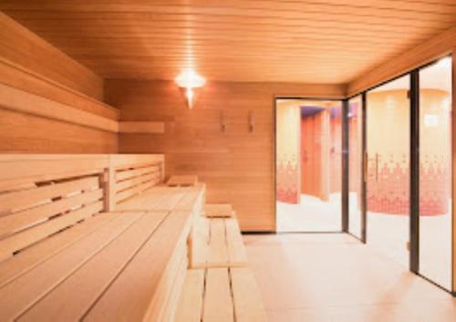 an empty sauna with benches in a room at Carat Apartments Grömitz in Grömitz
