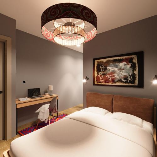 Postel nebo postele na pokoji v ubytování Sandyk At-Bashy Hotel