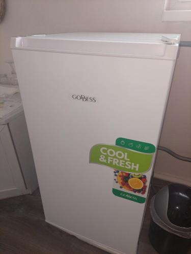 a white refrigerator with a sign on the top of it at Mia Pálava in Mikulov