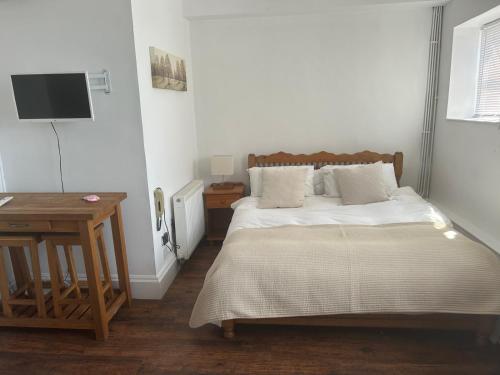 Ένα ή περισσότερα κρεβάτια σε δωμάτιο στο Beautiful 2bed flat with character - Bridge street
