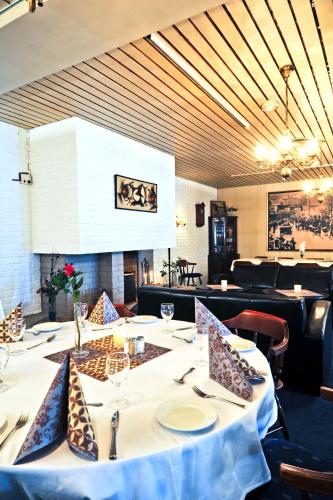a dining room with a table and chairs at Moi Hotel in Moi