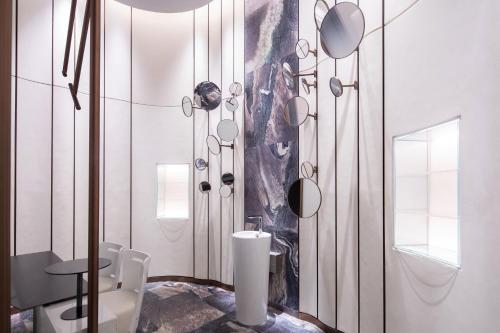 a bathroom with a sink and a toilet in it at W Chengdu in Chengdu
