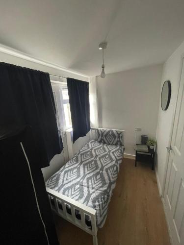 a bedroom with a bed and a window at Modern 4 Bed Home, Free Parking in Hartlepool town in Hartlepool