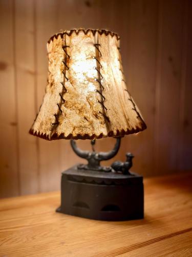 a lamp sitting on top of a table at Willa Pod Orłem Jacuzzi Sauna in Kościelisko