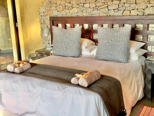 Ένα ή περισσότερα κρεβάτια σε δωμάτιο στο Tinkers Lakeside Lodge - Kruger