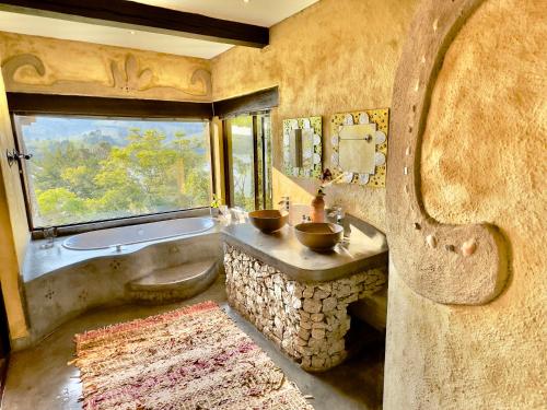 Ένα μπάνιο στο Tinkers Lakeside Lodge - Kruger