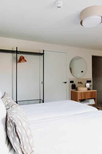 Ένα ή περισσότερα κρεβάτια σε δωμάτιο στο Boutique Apartments Koogerend