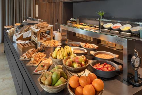a buffet line with many different types of food at Melia Luxembourg in Luxembourg