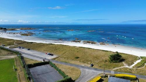 an aerial view of a beach and the ocean at Vue mer - 100m de la plage - 4 adultes 1 enfants in Plounéour-Trez