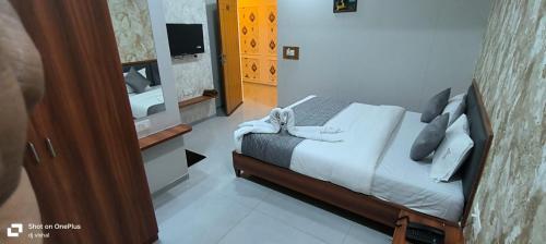 Ένα ή περισσότερα κρεβάτια σε δωμάτιο στο Hotel Cloud 7