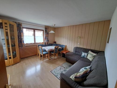 a living room with a couch and a table at Haus Grünanger in Wildschönau