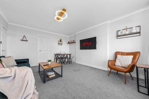 a living room with a couch and a table at Quirky, Family Home in Glasgow in Cardonald