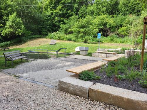 a park with two benches and a picnic table and a park at Ferienwohnung Felsenblick in Albstadt