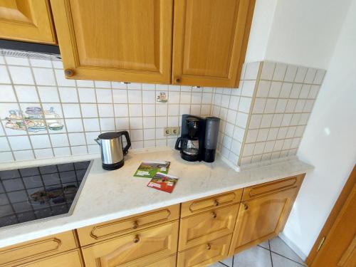 a kitchen counter with a coffee maker on it at Ferienwohnung Felsenblick in Albstadt