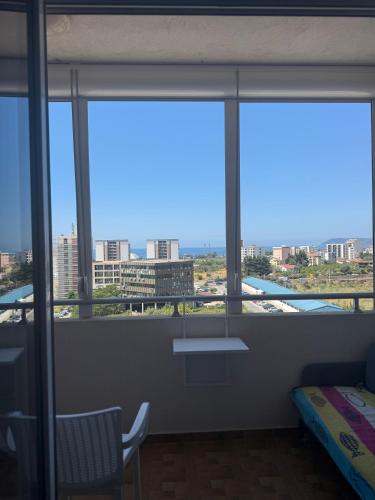a room with a window with a view of a city at Sargo Apartman Bar in Bar