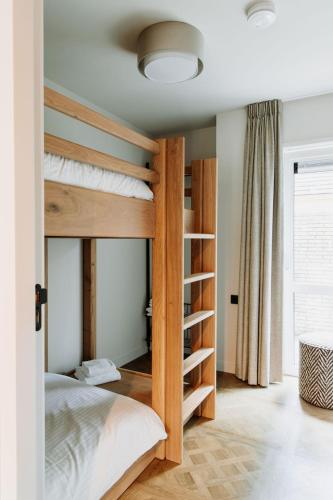 Ένα ή περισσότερα κρεβάτια σε δωμάτιο στο Boutique Apartments Koogerend