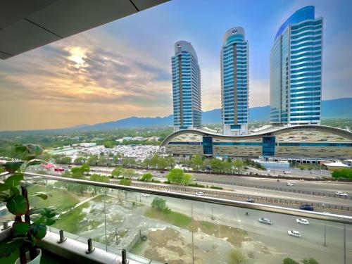 a view of a city with tall buildings at Elysium Luxe Stays Facing Cenaturus Mall Islamabad in Islamabad