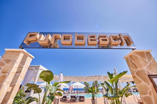 a sign at the entrance to the disneyland resort at AluaSoul Menorca - Adults Only in S'Algar