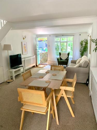 a living room with a table and a couch at Richmond Escape in Richmond upon Thames